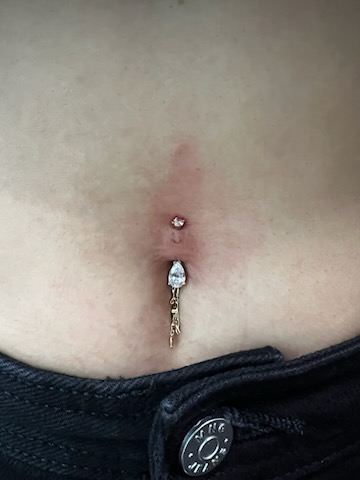 Bellybutton body piercing with jewelry