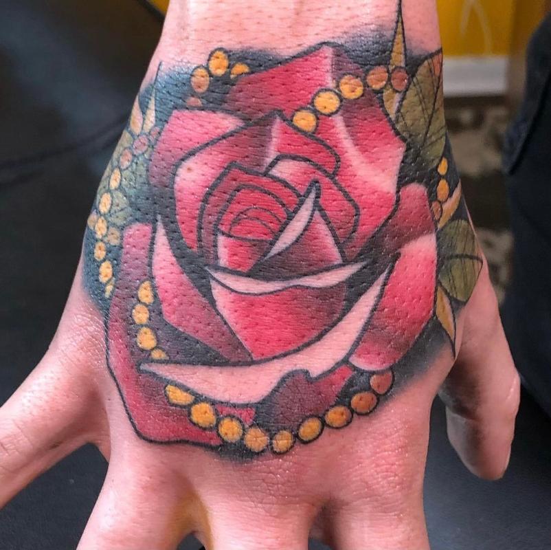 rose tattoo hand