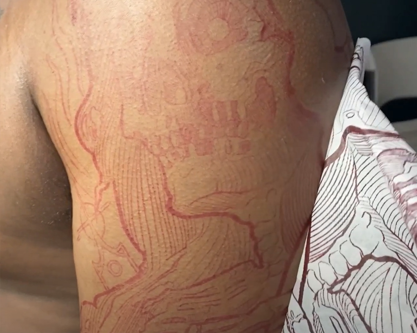 example of contour lines and red tattoo stencil paper