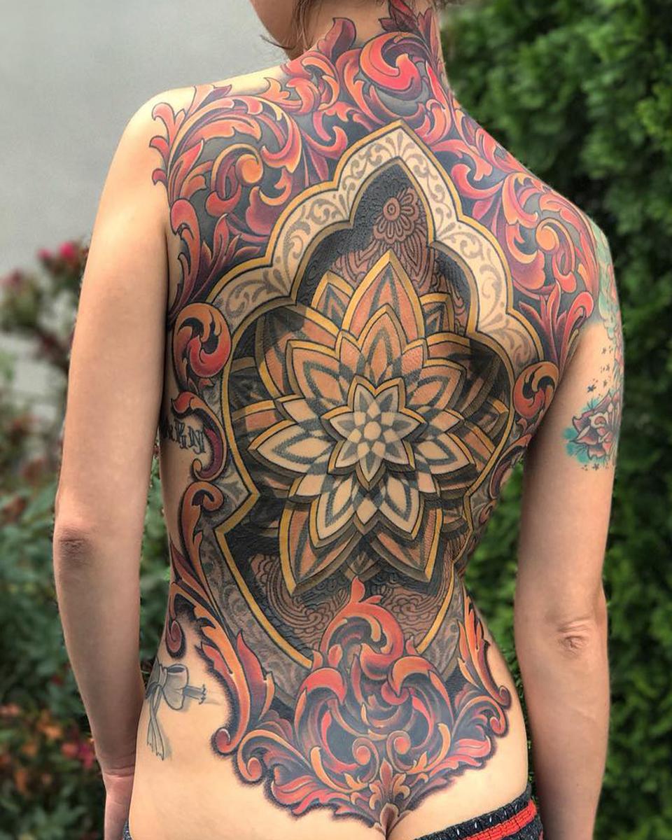 floral filigree and scrollwork back tattoo by russ abbott