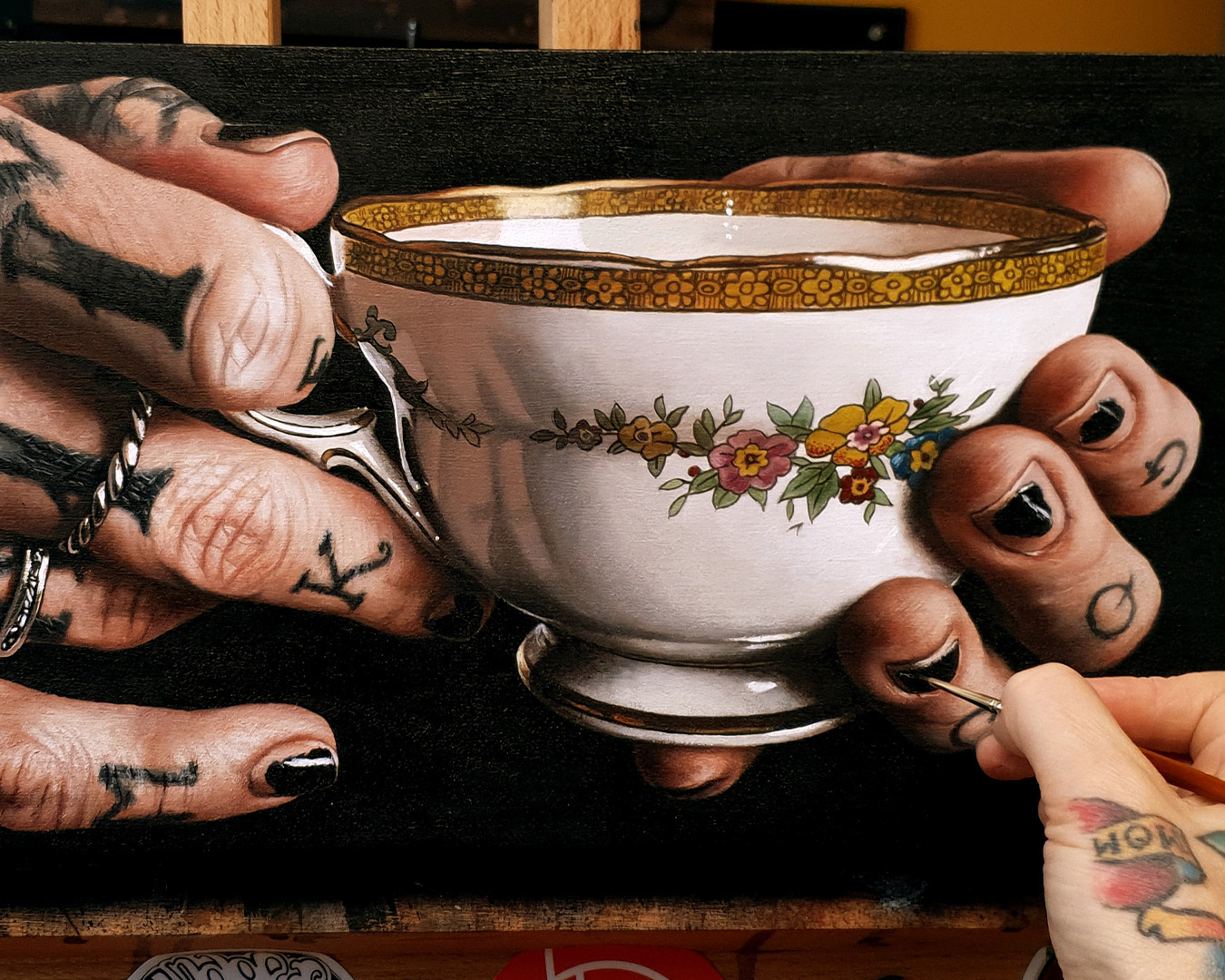 Jackee Sandelands acrylic painting hyper realistic hand and teacup