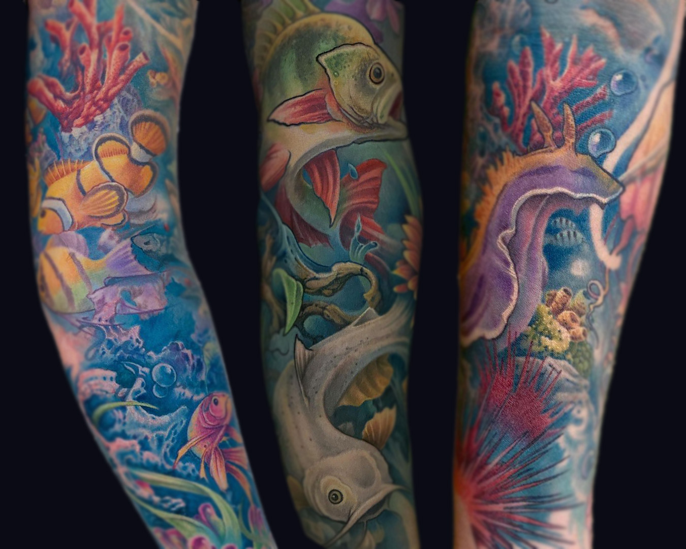 fish sea animals and coral seascape arm tattoos