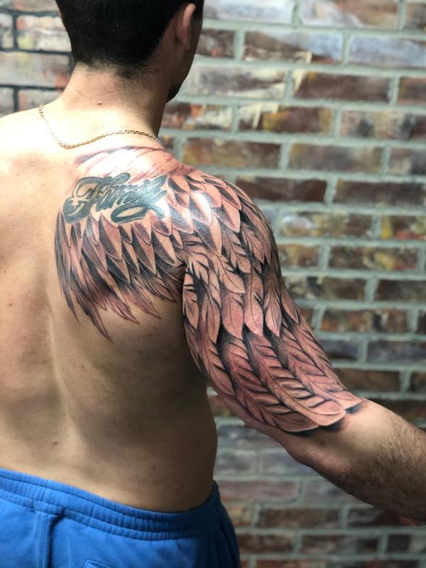 angel wings tattoo arm
