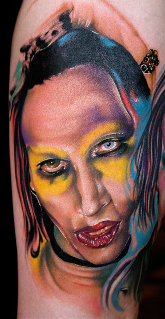 Marylin Manson portrait mashup tattoo on the left upper