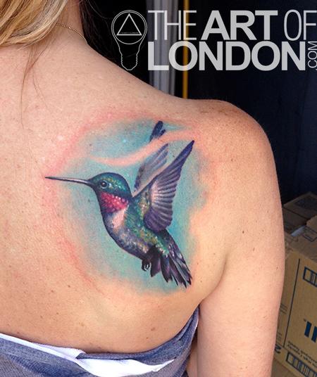 realistic color hummingbird tattooon ribs by Sorin Gabor  Tattoos