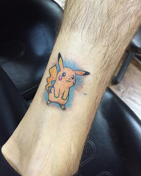 Pikachu tattoo done on the inner arm.