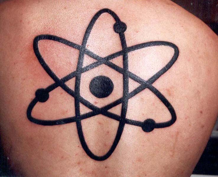 Atom tattoo located on the thigh.