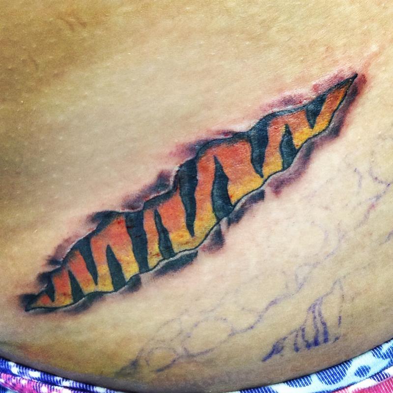 tiger stripe leg tattoo