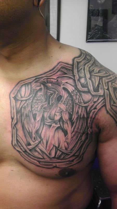 chest armor tattoo