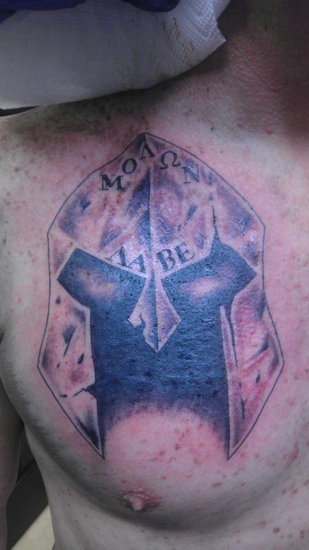 kevin.cly.tattoos skull wearing spartan helmet covered in arrows  @monumental.tattoo while using True Cartridge Tubes, True Cartridge… |  Instagram