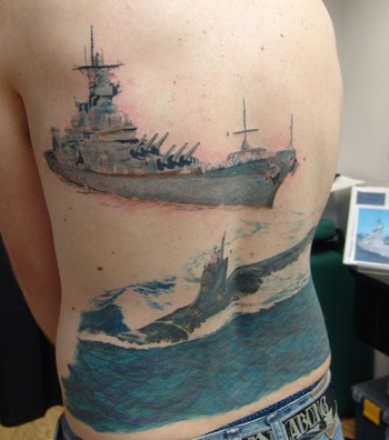 Traditional style warship tattoo on the ankle.
