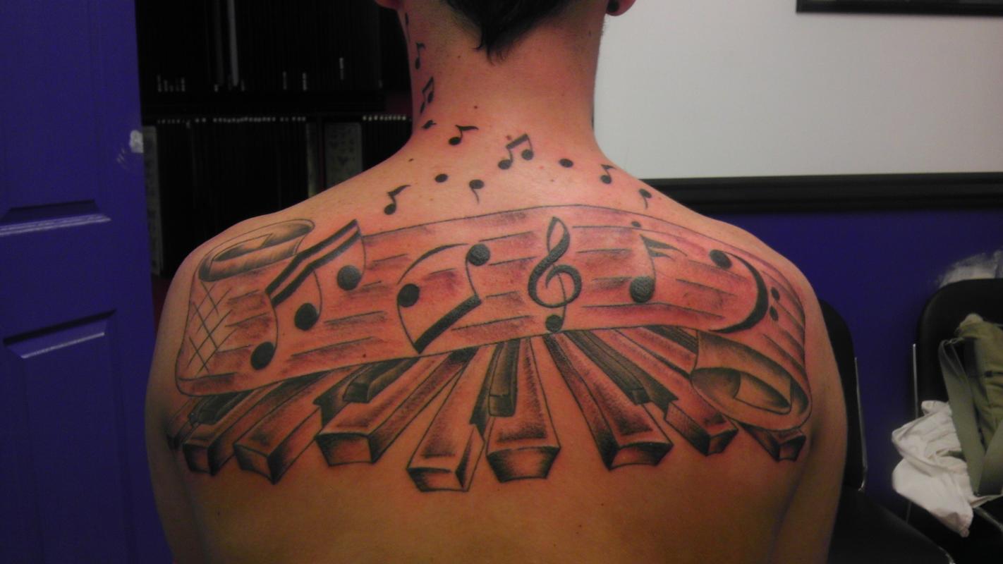 music notes tattoos on chest