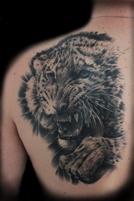 Micro-realistic style tiger portrait tattoo located on