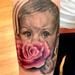 Tattoos - baby holding a rose portrait - 72547