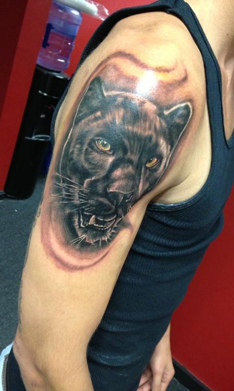 Tattoo uploaded by kolesmith903  Black Panther done in a tribal style that  transitions into realistic panther blackpanther tribal realism  transitional forearm  Tattoodo