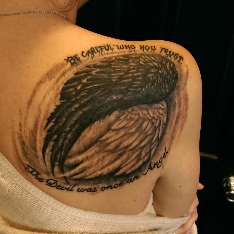 good and evil wings tattoo