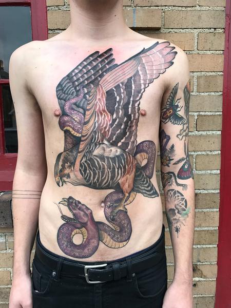 Blackwork snakes and peonie tattoo on the chest.