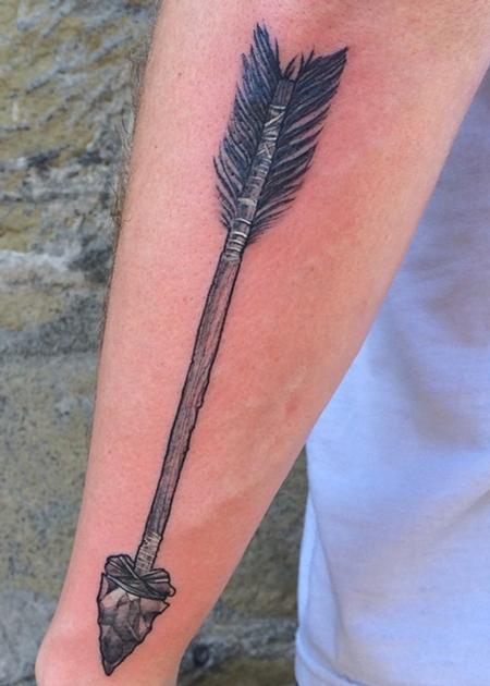 Micro-realistic style bow and arrow tattoo located on