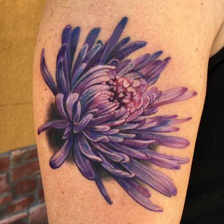 Chrysanthemum tattoo located on the wrist, illustrative