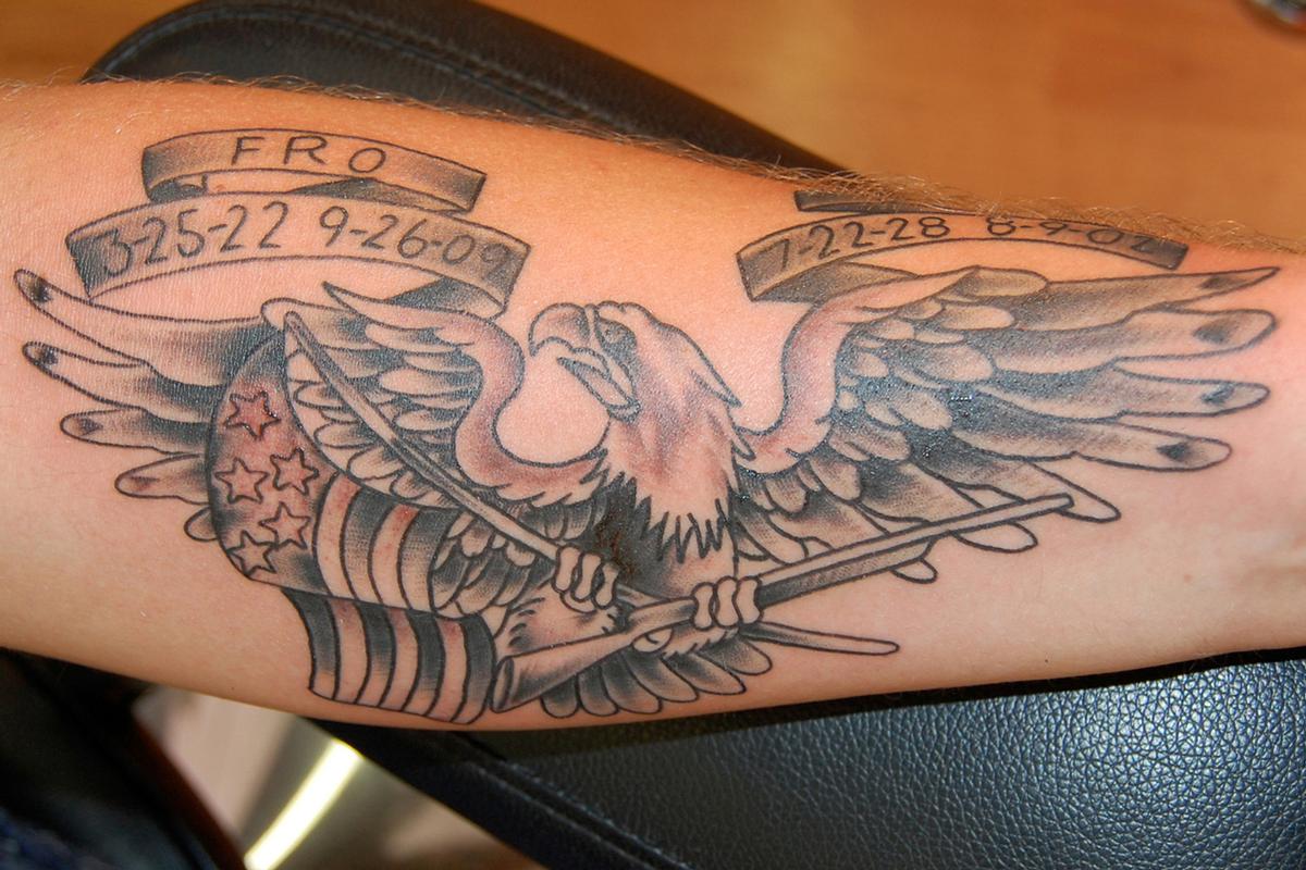 eagle carrying flag tattoo
