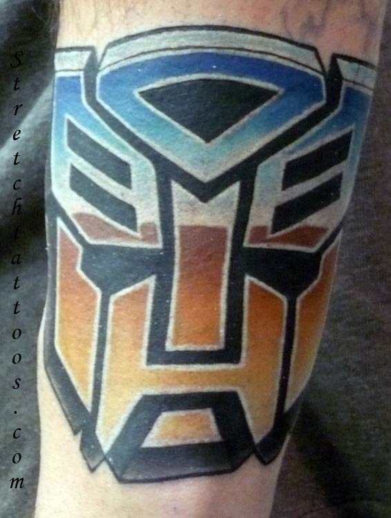 decepticon and autobot logo tattoo