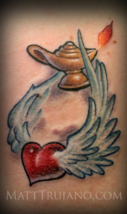 Robin bird tattoo located on the upper arm.