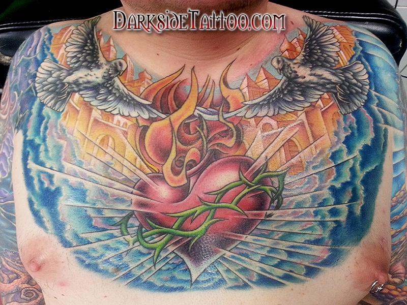Sacred Heart Tattoo On Girl Chest