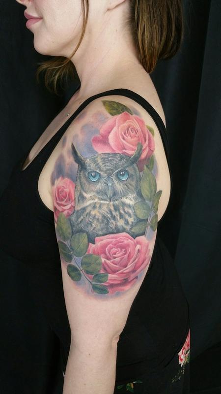 Black  white ink roses and owl tattoo on forearm
