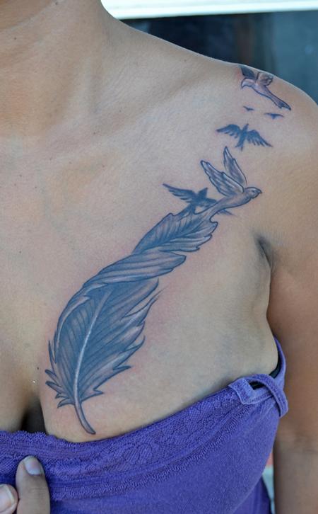 Coverup tattoo covered with feather and birds by b by