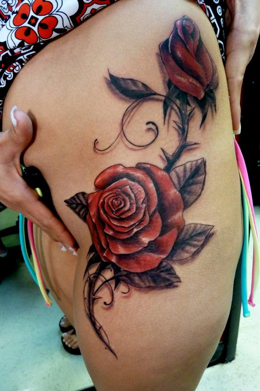 Rose tattoo located on the hip fine line style